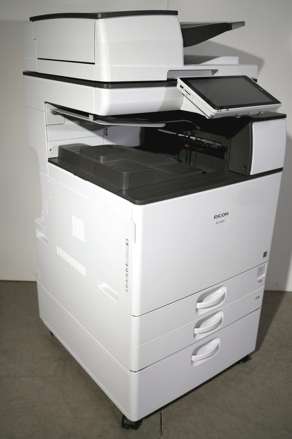 Ricoh IM 4000 low-meter copier, left side view showing control panel and paper trays – Copier Liquidation Center
