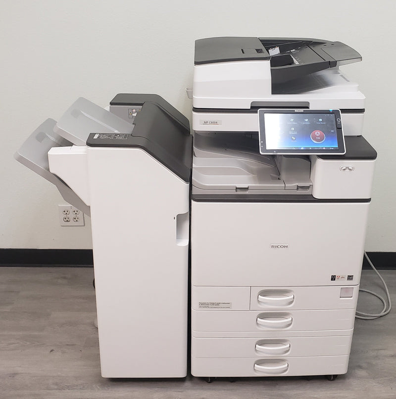 Used Ricoh MP C6004 low-meter color copier with booklet finisher, front view – Copier Liquidation Center