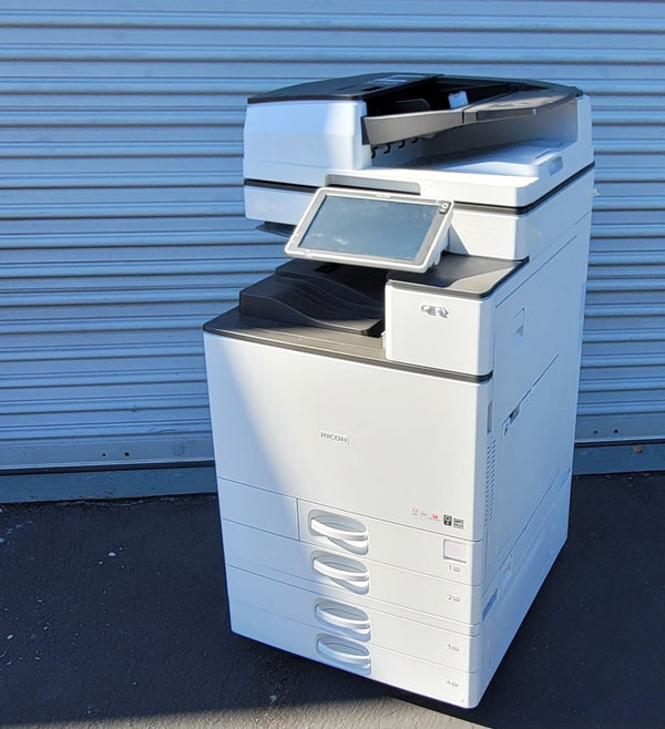 Ricoh MP C6004 color copier front view with control panel and paper trays – Copier Liquidation Center